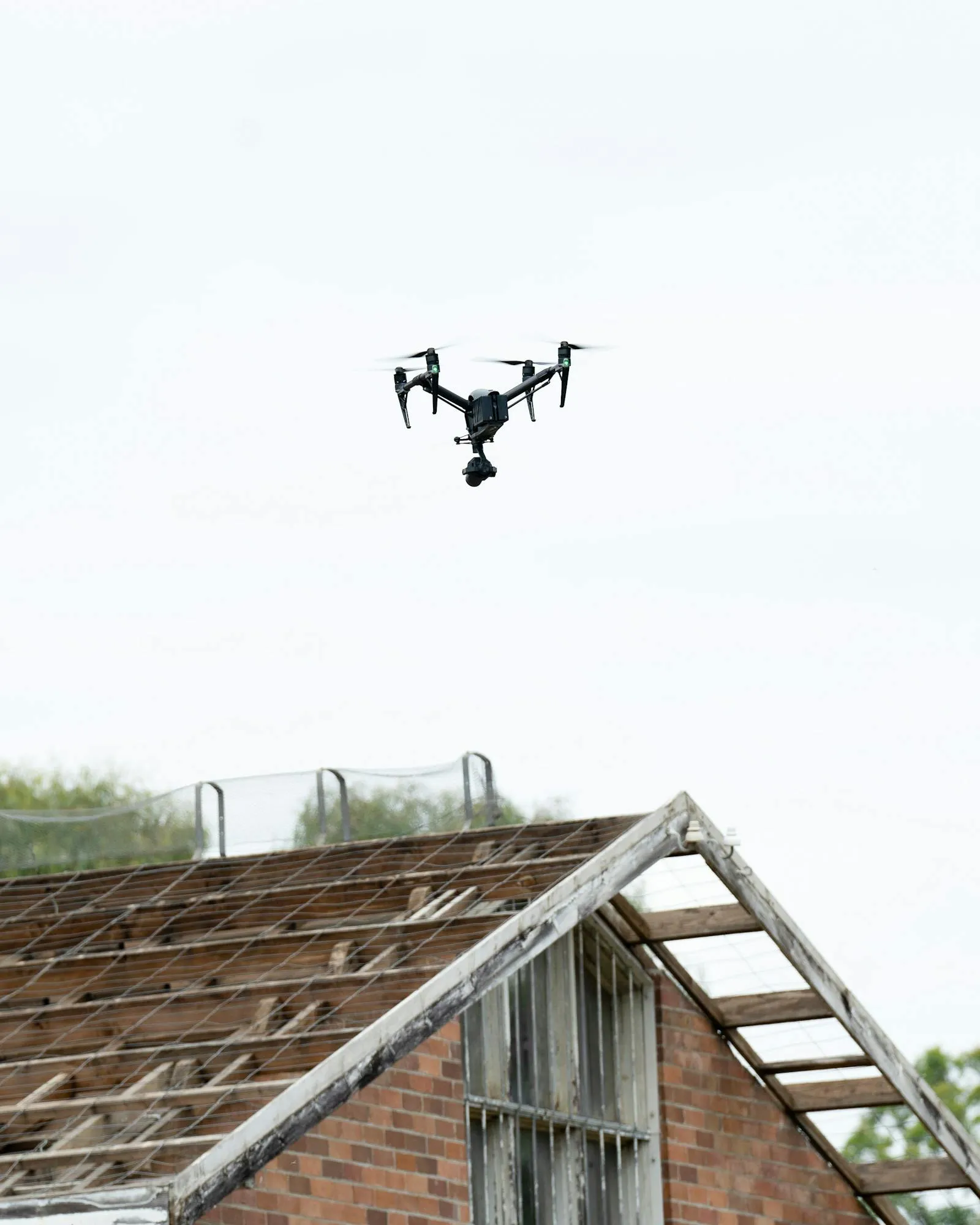 Drone conducting a façade inspection on a Hong Kong residential building